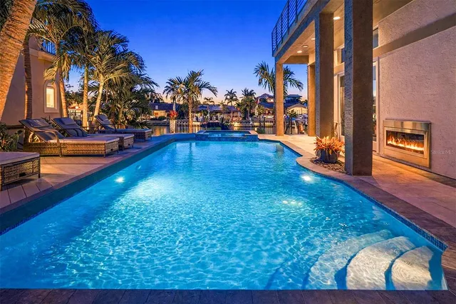 a view of a swimming pool with an outdoor seating