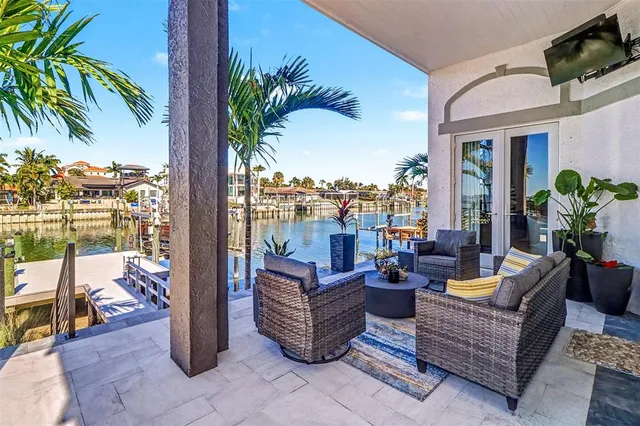 a outdoor living space with furniture and a potted plant