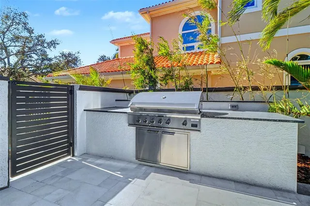 a swimming pool with outdoor seating and yard