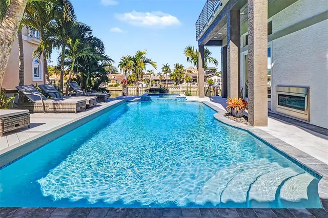 a room with pool table and outdoor seating
