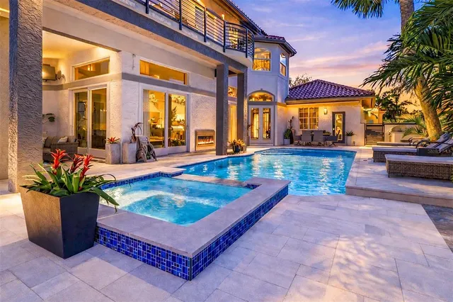 a view of a swimming pool next to a lake