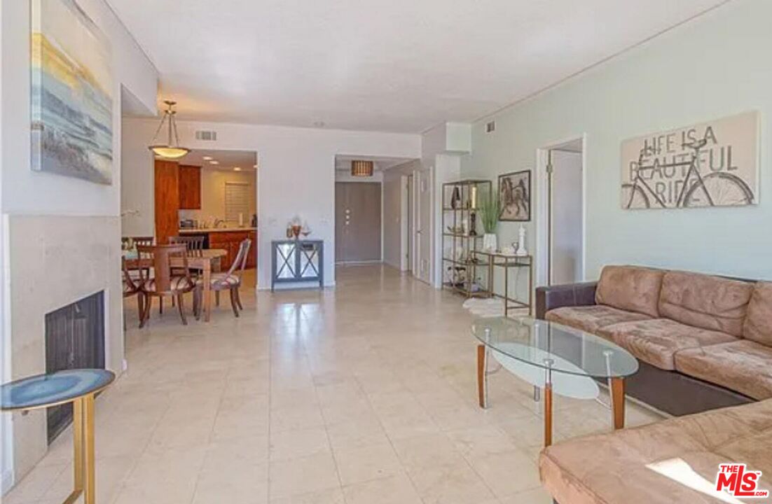 723 Westmount Drive, Unit 203 West Hollywood, CA 90069 - Photo 1 of 17 a living room with furniture and wooden floor