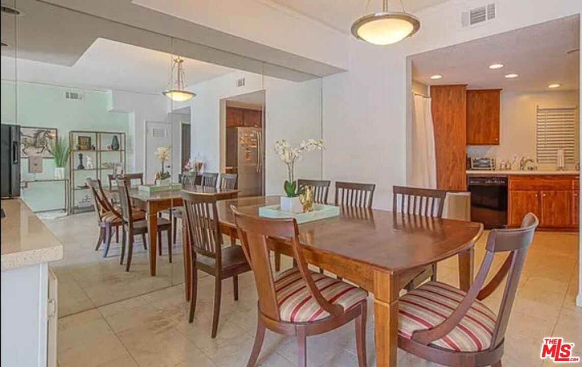 723 Westmount Drive, Unit 203 West Hollywood, CA 90069 - Photo 4 of 17 a view of a dining room with furniture