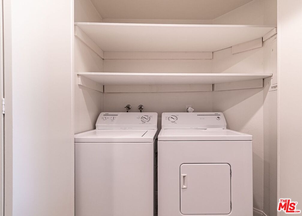 723 Westmount Drive, Unit 203 West Hollywood, CA 90069 - Photo 5 of 17 a utility room with dryer and washer