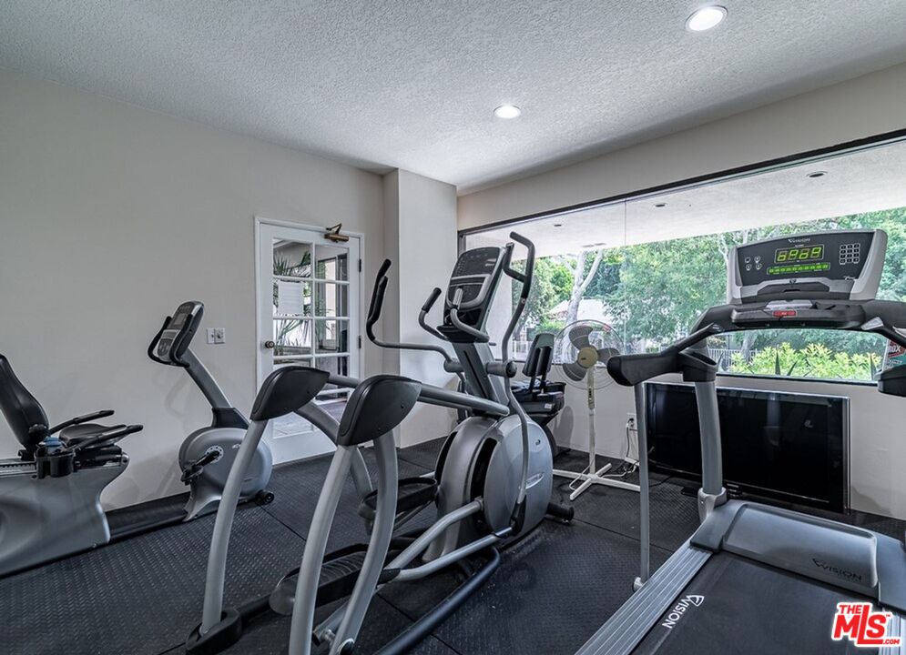 723 Westmount Drive, Unit 203 West Hollywood, CA 90069 - Photo 6 of 17 a view of a room with gym equipment