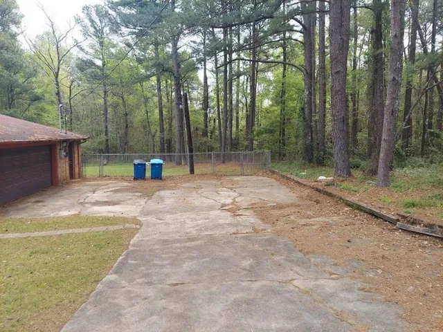 a view of outdoor space with deck and trees