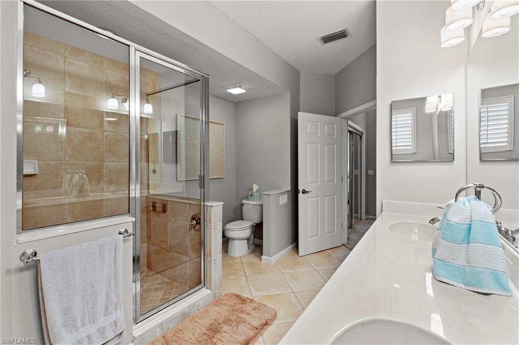 10422 Autumn Breeze Drive, Unit 201 Estero, FL 34135 - Photo 19 of 34 a bathroom with a shower and a sink