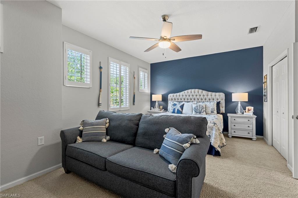 10422 Autumn Breeze Drive, Unit 201 Estero, FL 34135 - Photo 21 of 34 a living room with furniture and a window