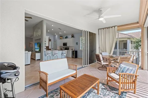 a view of a roof deck with furniture