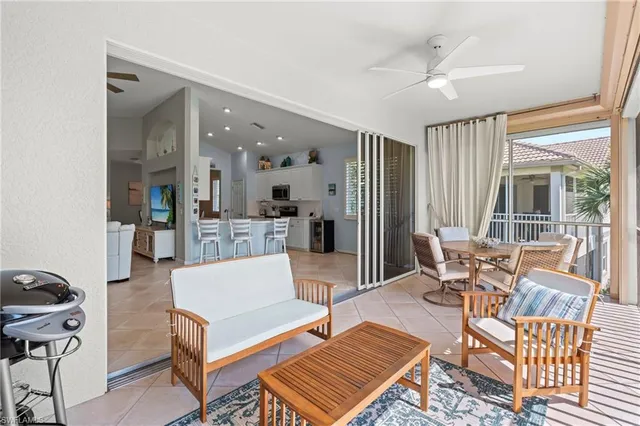 a view of a roof deck with furniture