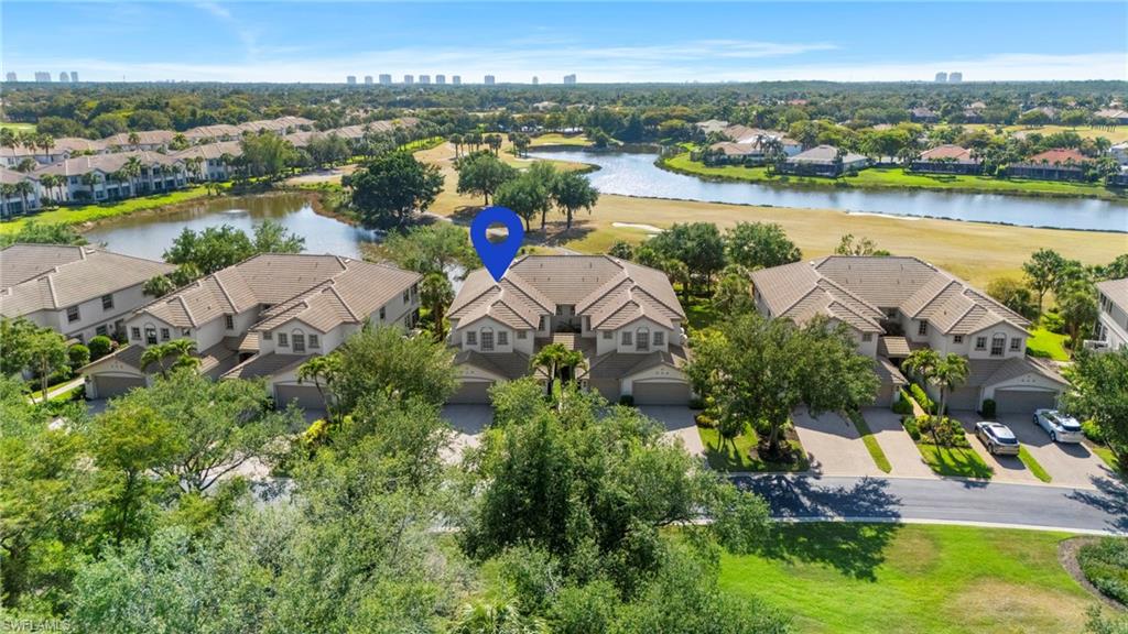 10422 Autumn Breeze Drive, Unit 201 Estero, FL 34135 - Photo 3 of 34 an aerial view of a city with lake view
