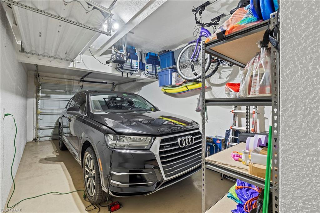 10422 Autumn Breeze Drive, Unit 201 Estero, FL 34135 - Photo 31 of 34 a utility room with dryer and washer