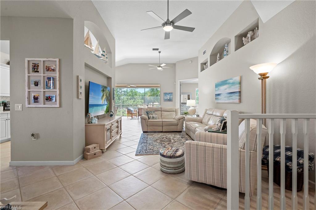 10422 Autumn Breeze Drive, Unit 201 Estero, FL 34135 - Photo 6 of 34 a living room with furniture and a large window