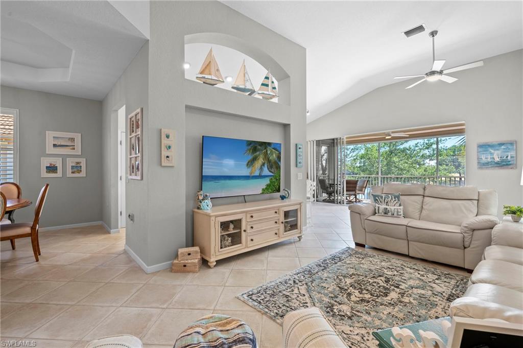 10422 Autumn Breeze Drive, Unit 201 Estero, FL 34135 - Photo 7 of 34 a living room with furniture and a flat screen tv