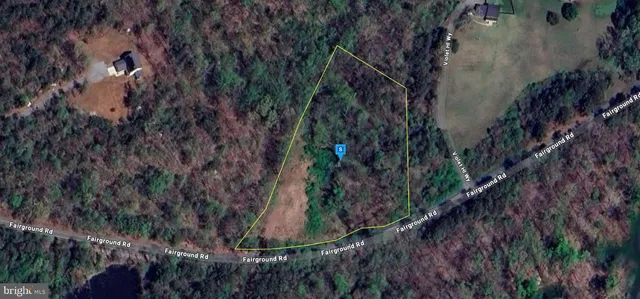 a view of a backyard of the house