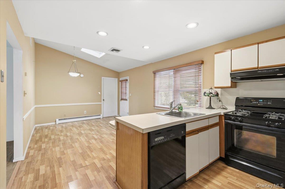 13 Jean Road West Islip, NY 11795 - Photo 25 of 25 a kitchen with a sink stove and cabinets
