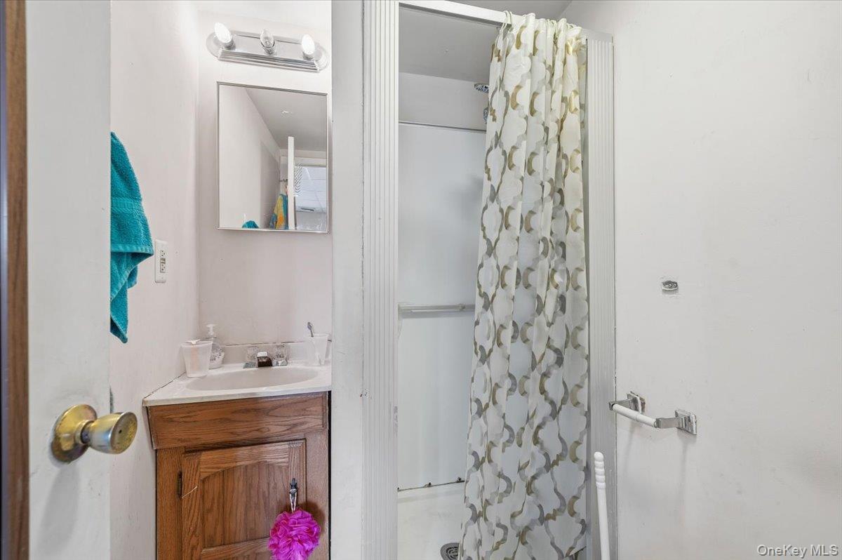 13 Jean Road West Islip, NY 11795 - Photo 15 of 25 a bathroom with a shower and a sink