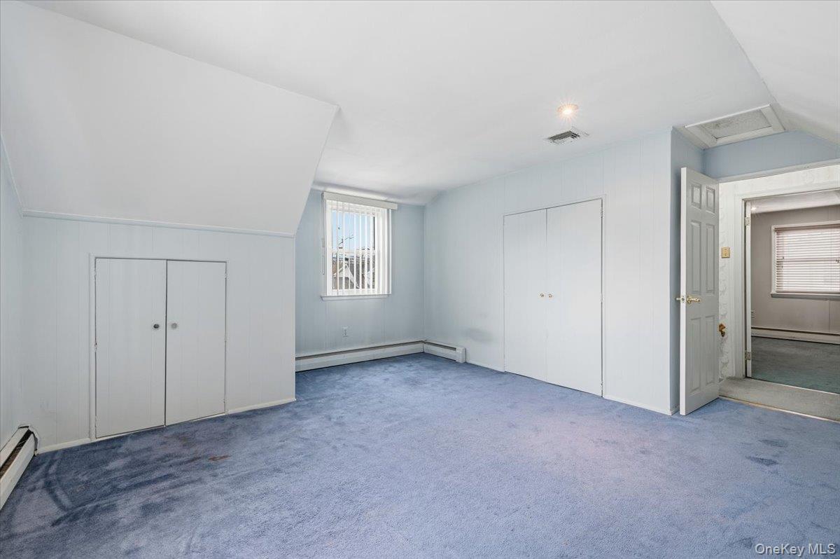 13 Jean Road West Islip, NY 11795 - Photo 16 of 25 an empty room with windows and closet
