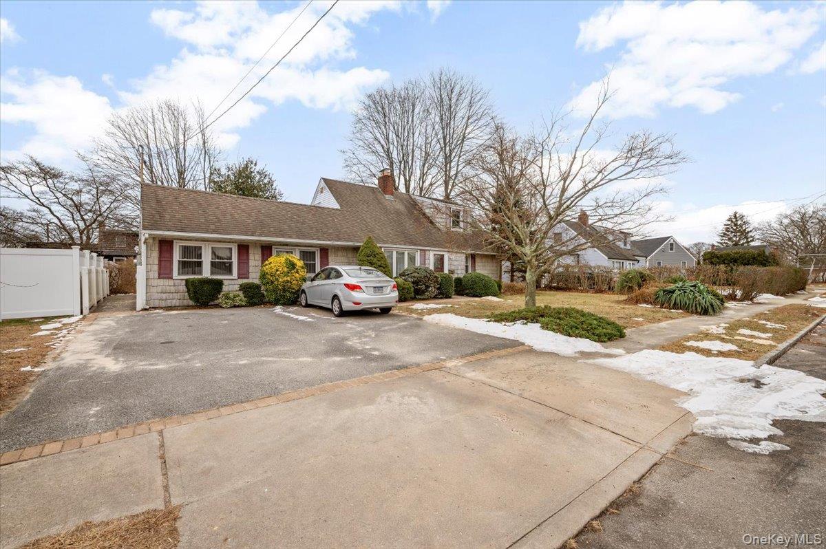 13 Jean Road West Islip, NY 11795 - Photo 2 of 25 a car parked in front of a building