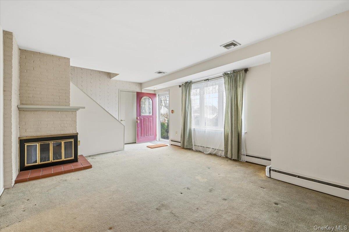 13 Jean Road West Islip, NY 11795 - Photo 3 of 25 an empty room with windows