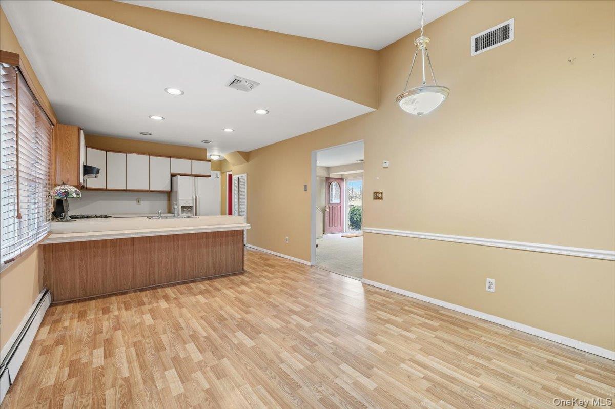 13 Jean Road West Islip, NY 11795 - Photo 6 of 25 a large kitchen with a lot of counter space and wooden floor