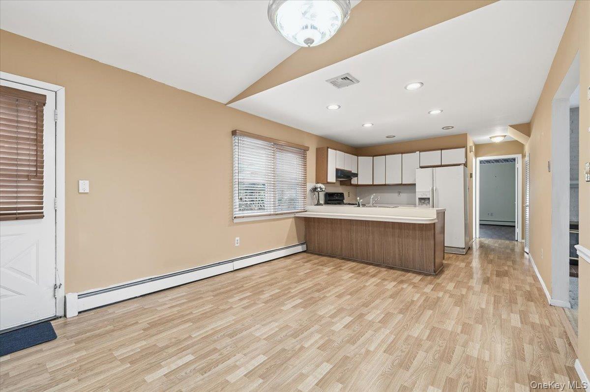 13 Jean Road West Islip, NY 11795 - Photo 8 of 25 a large kitchen with a lot of counter space and wooden floor