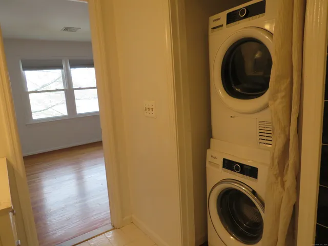 a view of a hallway with washer and dryer