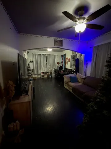 a living room with lots of furniture and a flat screen tv