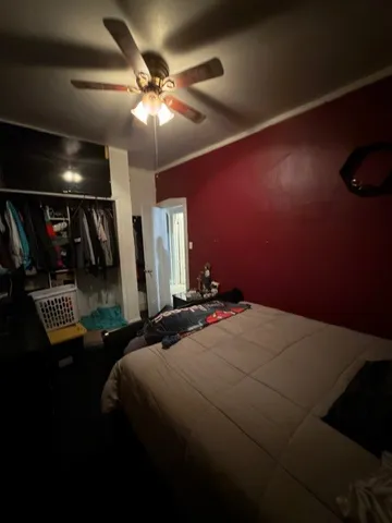 a bed sitting in a room next to a window