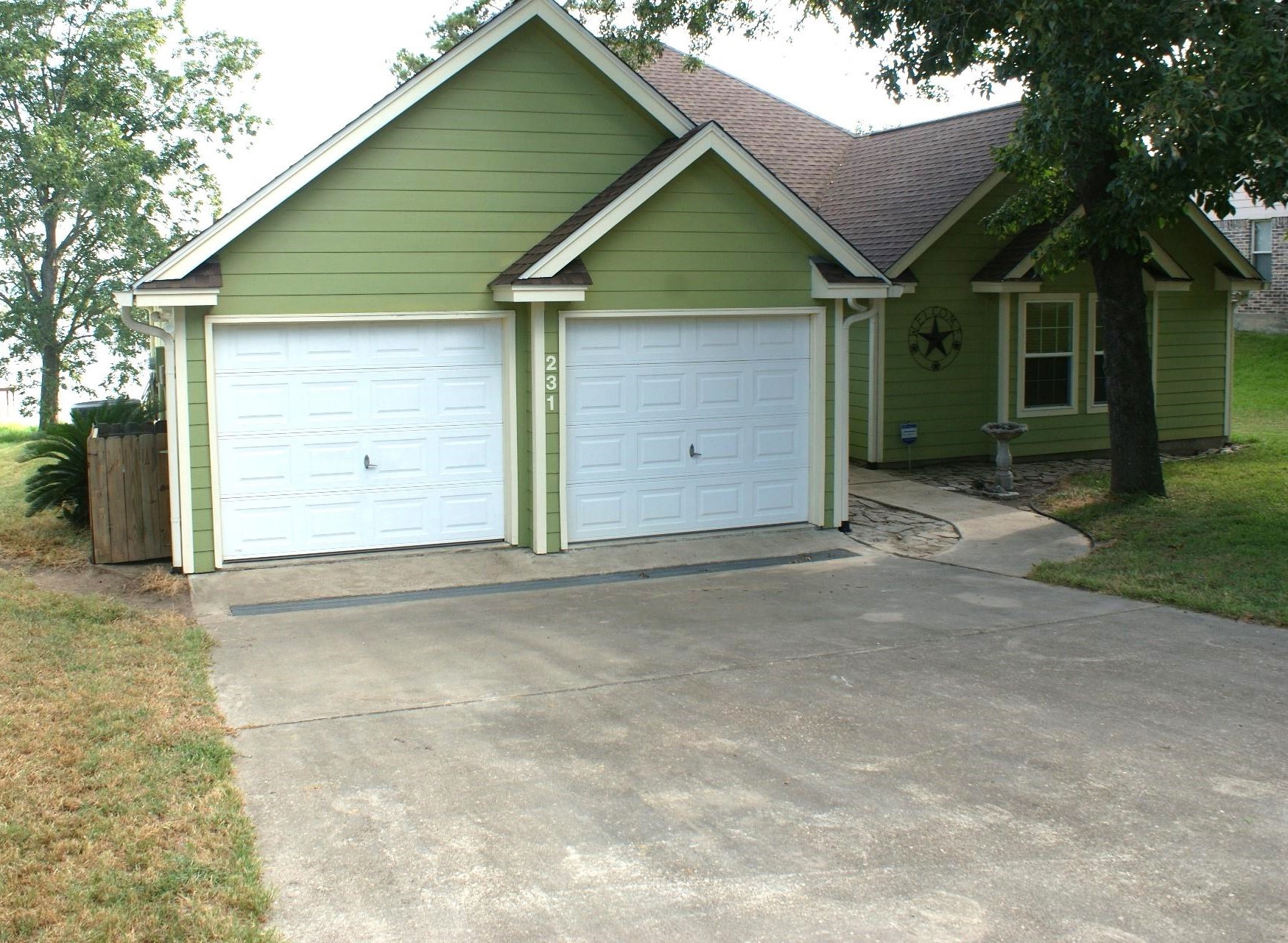 231 Memphis Belle Trinity, TX 75862 - Photo 15 of 47 a view of a house with a outdoor space and garage