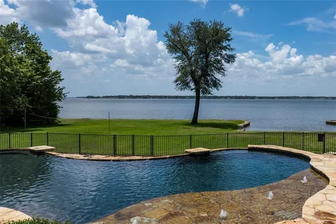 a view of a lake with a yard