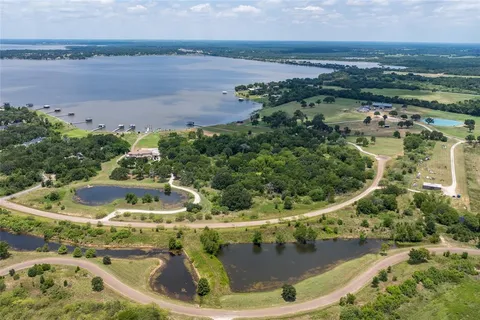 a view of a swimming pool with a yard