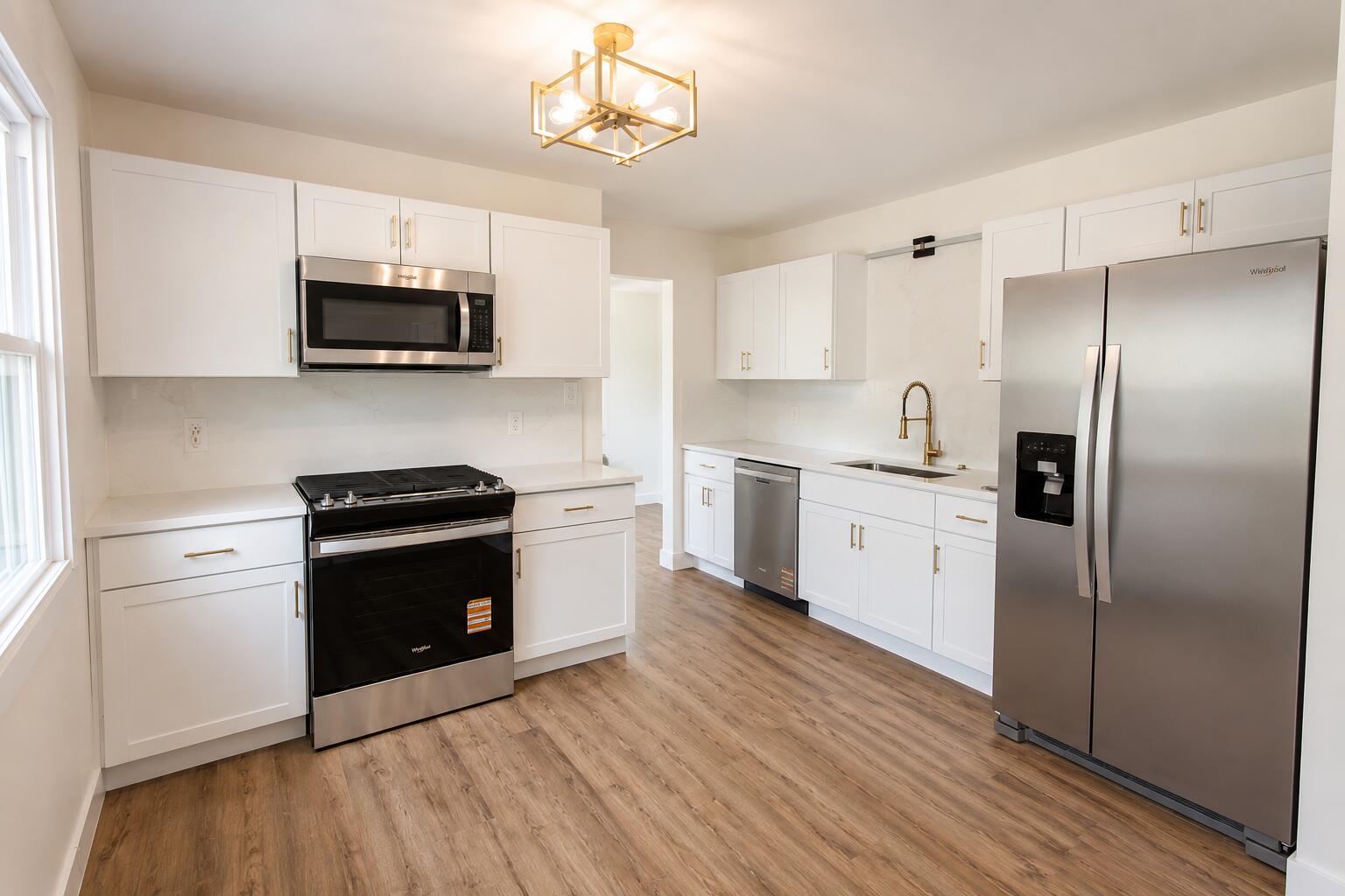 414 Holly Road Michigan City, IN 46360 - Photo 17 of 41 a kitchen with stainless steel appliances a refrigerator sink and microwave