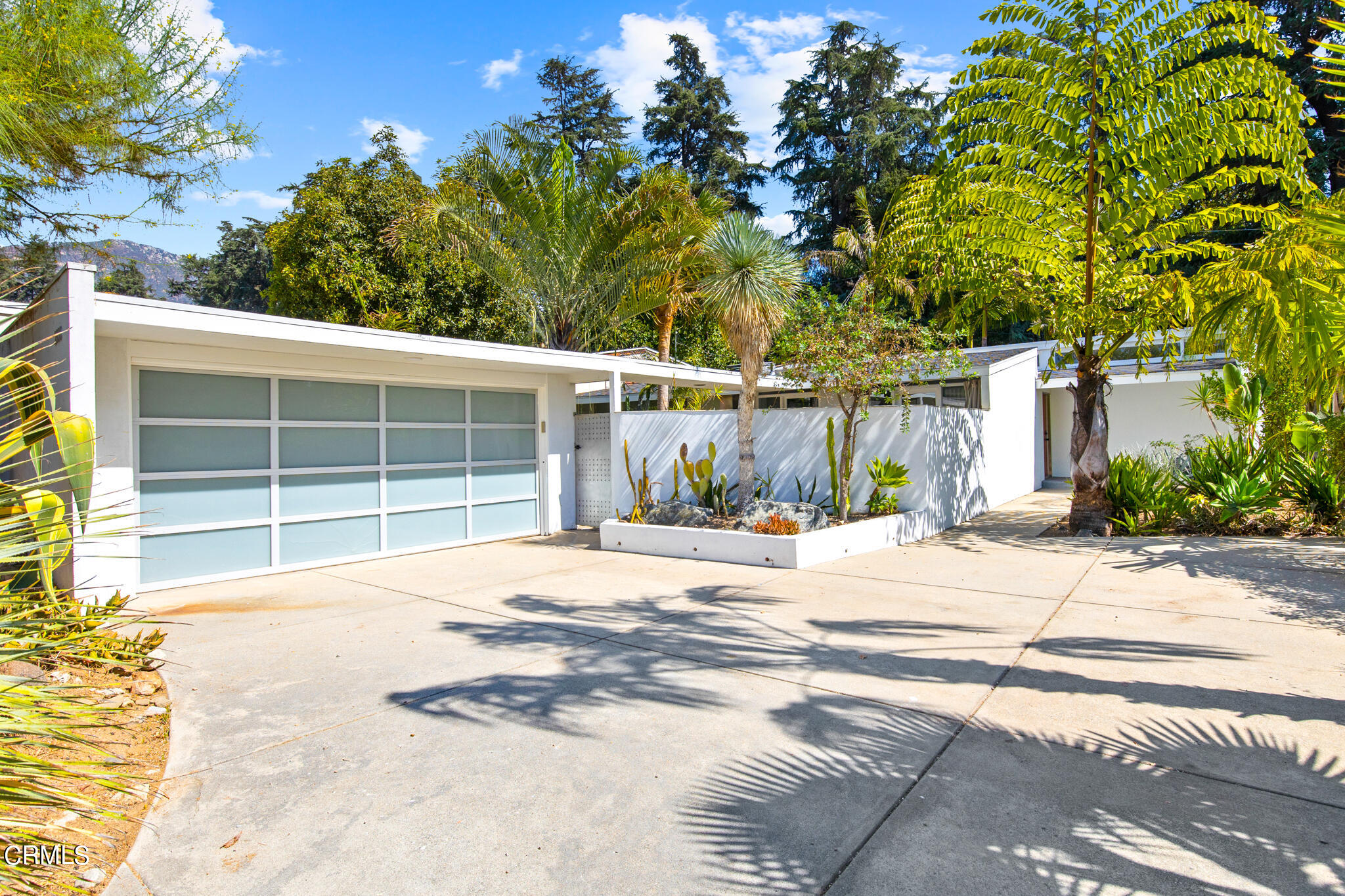 a view of a house with a yard and garage