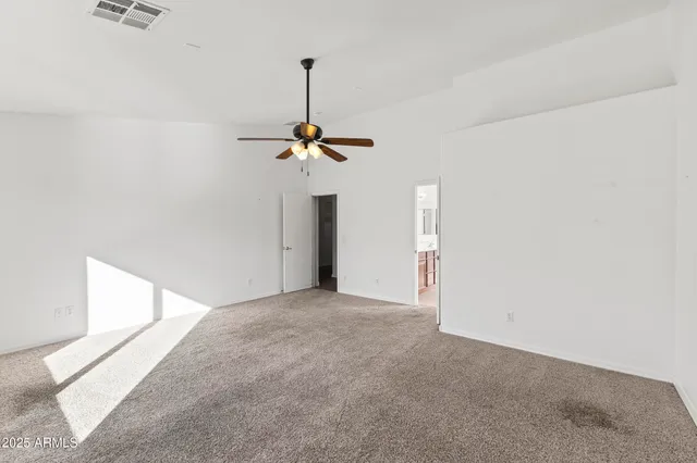 an empty room with a chandelier