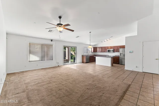 a view of a kitchen with a sink and a stove top oven