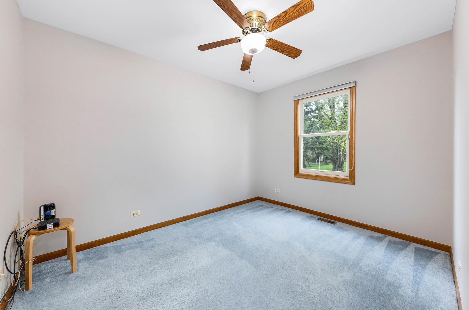 1751 Mundelein Road Naperville, IL 60565 - Photo 17 of 37 an empty room with a window and a fan