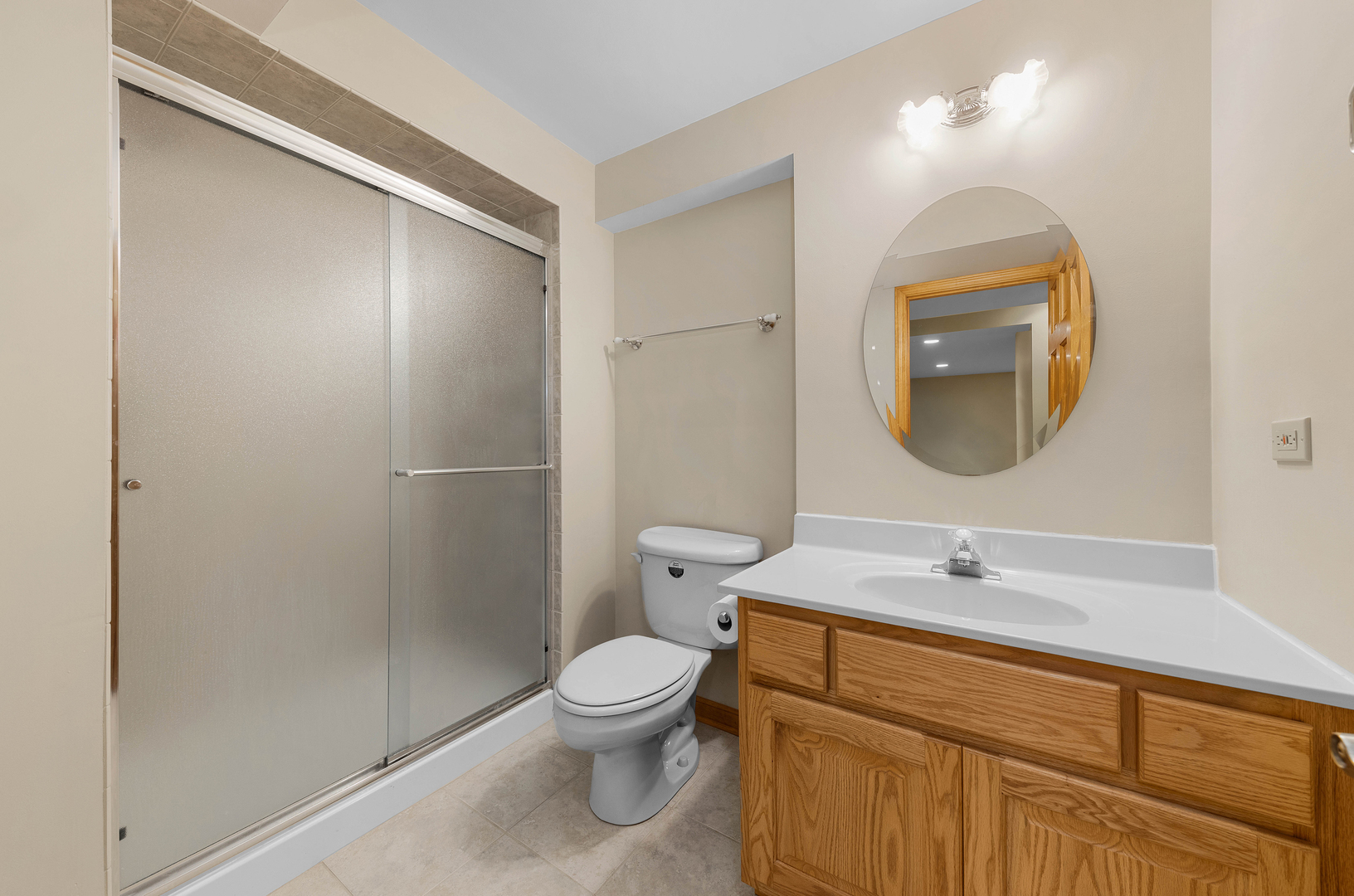 1751 Mundelein Road Naperville, IL 60565 - Photo 33 of 37 a bathroom with a sink and a mirror
