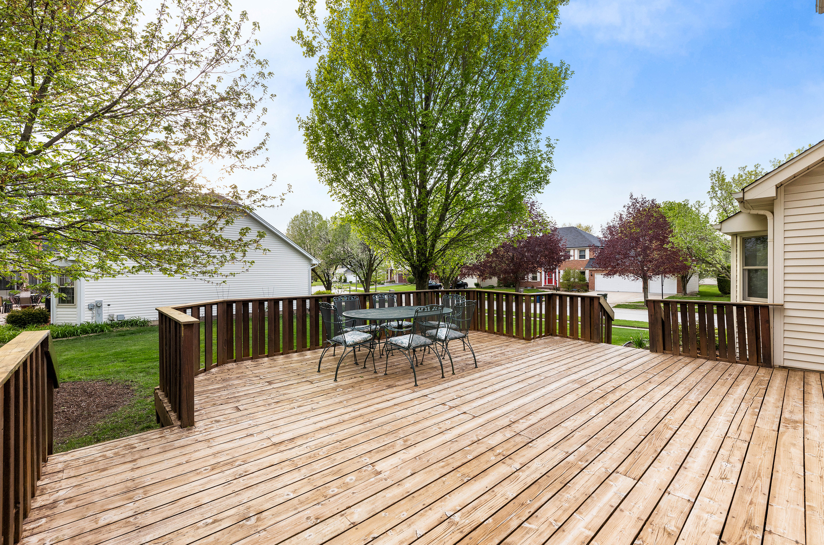 1751 Mundelein Road Naperville, IL 60565 - Photo 34 of 37 a view of a deck with chairs and large trees