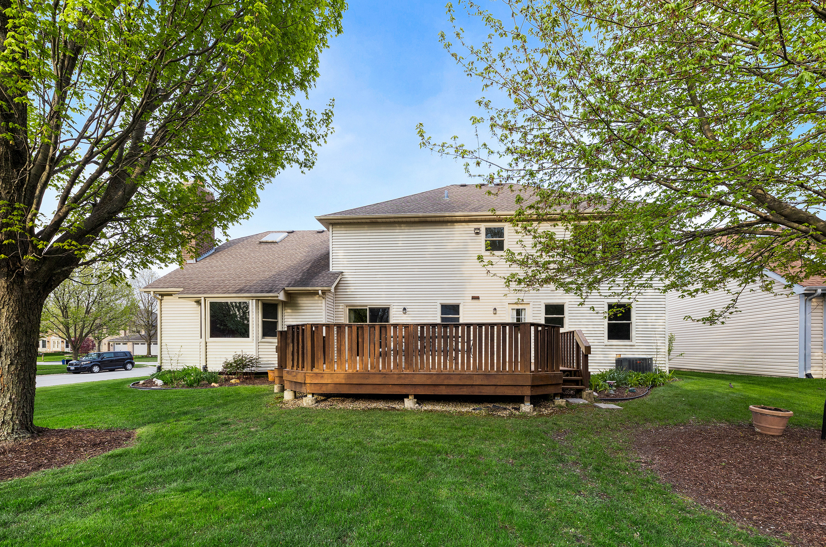 1751 Mundelein Road Naperville, IL 60565 - Photo 35 of 37 a view of backyard with a garden and deck