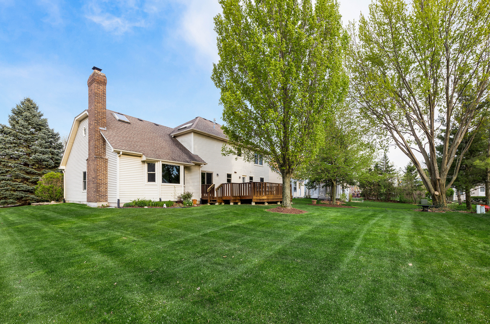 1751 Mundelein Road Naperville, IL 60565 - Photo 36 of 37 a big house with a big yard and large trees