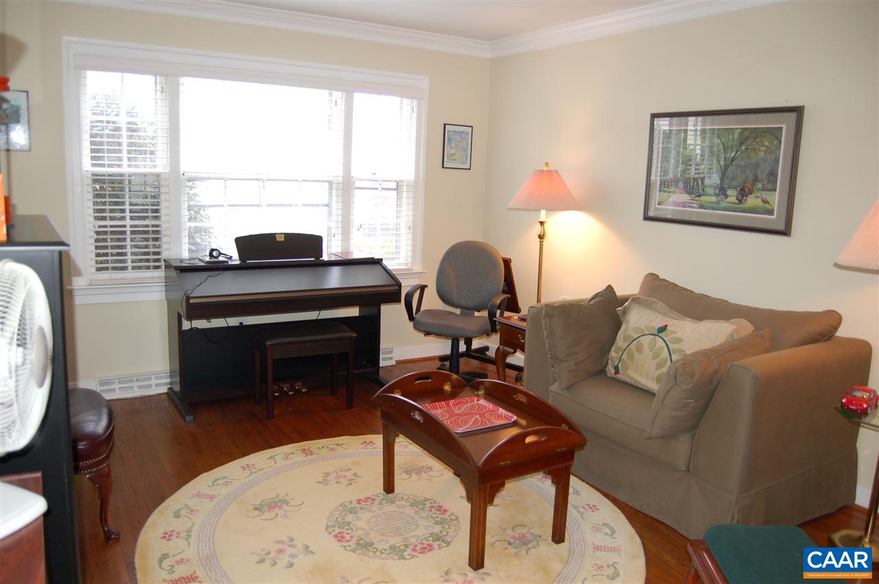 118 Hessian Hills Ridge, Unit 2 Charlottesville, VA 22901 - Photo 4 of 11 a living room with furniture a window and a fireplace