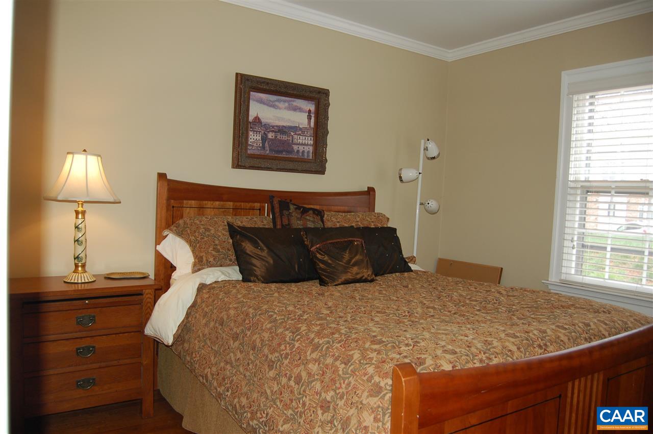 118 Hessian Hills Ridge, Unit 2 Charlottesville, VA 22901 - Photo 7 of 11 a bedroom with a bed and a lamp on dresser