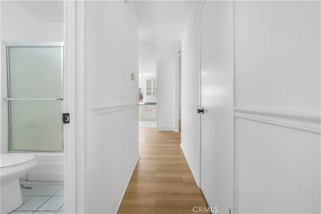 a view of a backyard with large trees