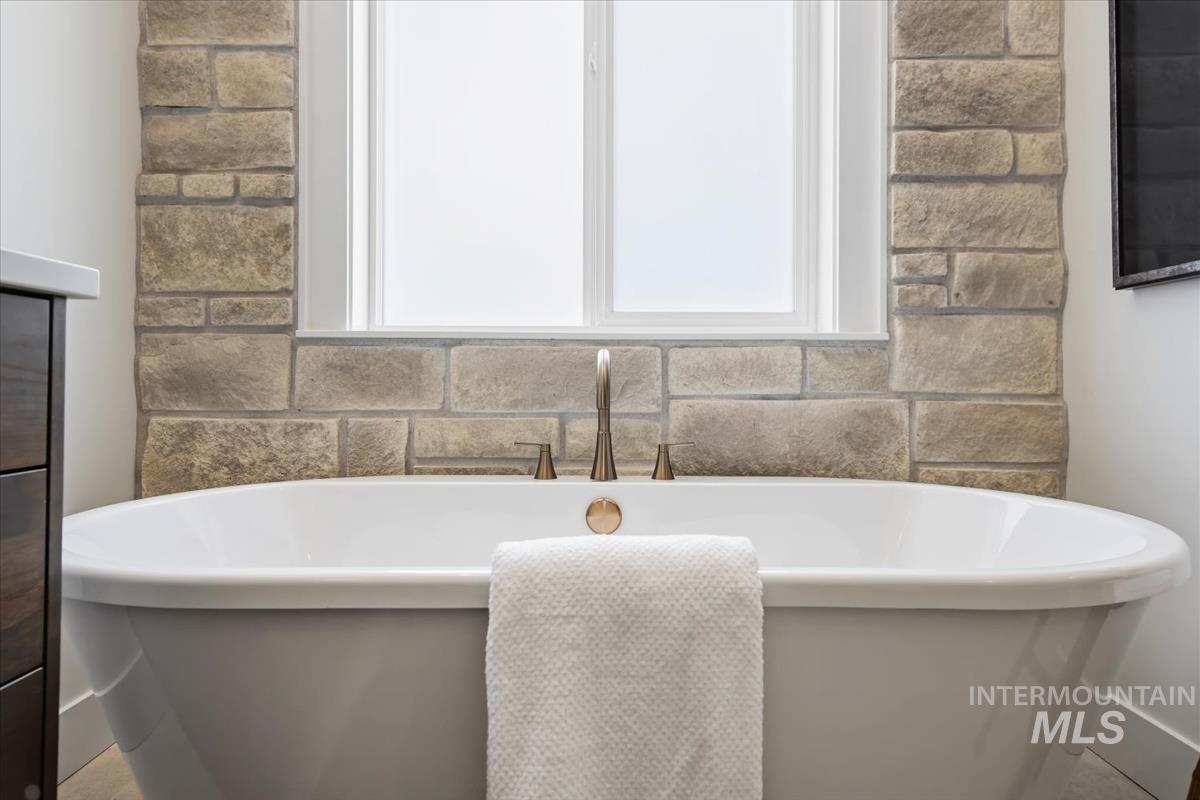 7615 Brown Way Eagle, ID 83714 - Photo 31 of 43 Freestanding soaking tub featuring wall-mounted fixtures