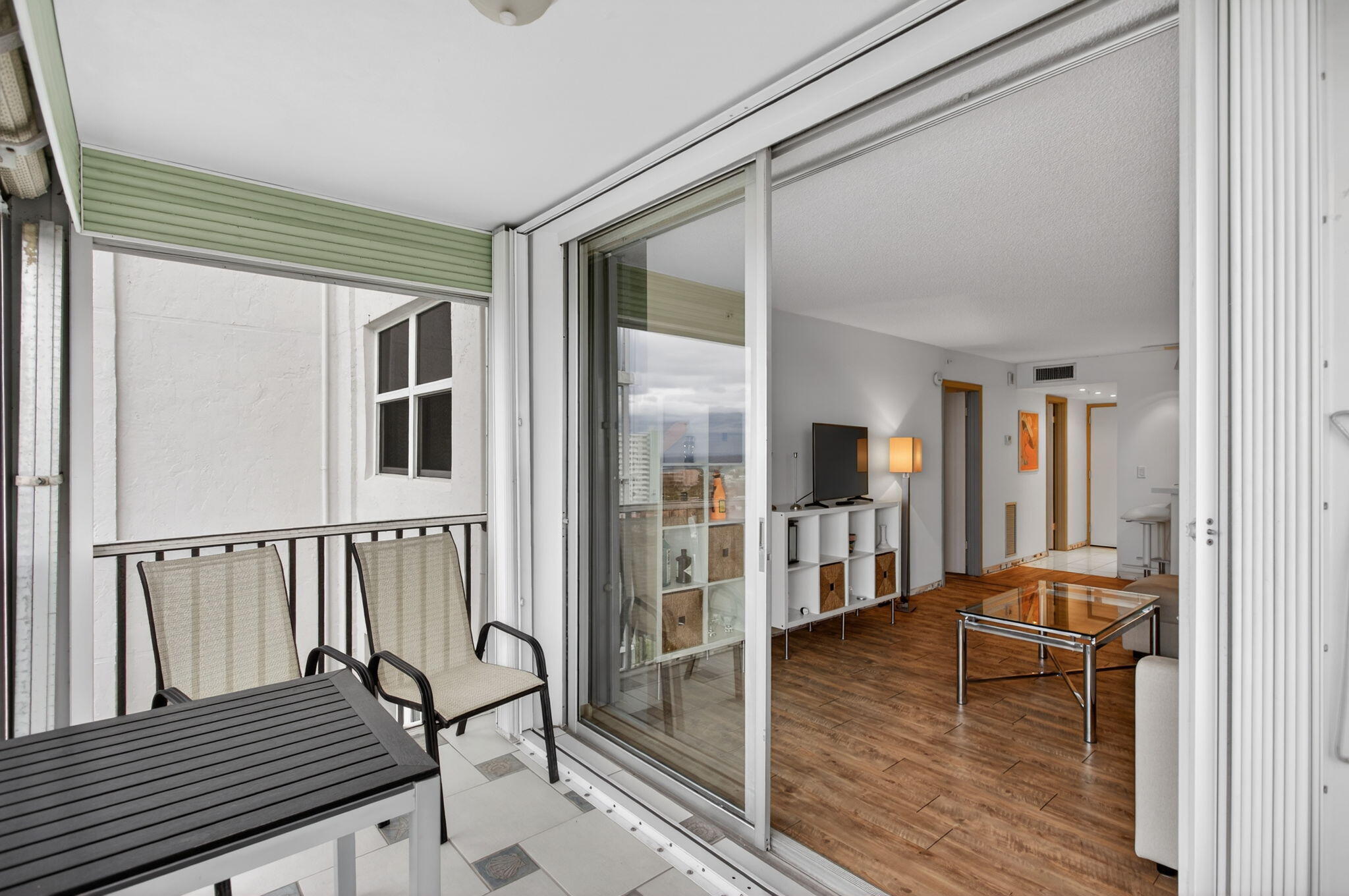 1505 North Riverside Drive, Unit 1107 Pompano Beach, FL 33062 - Photo 8 of 8 a living room with furniture and wooden floor