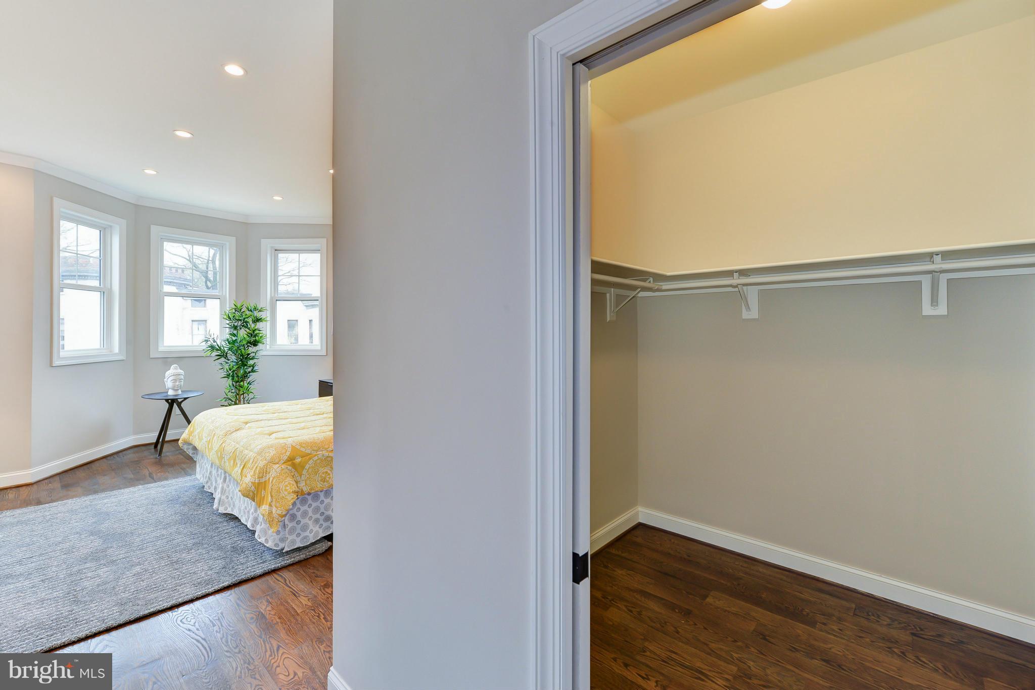 39 U Street Northeast, Unit 1 Washington, DC 20002 - Photo 17 of 27 a bedroom with a bed and wooden floor