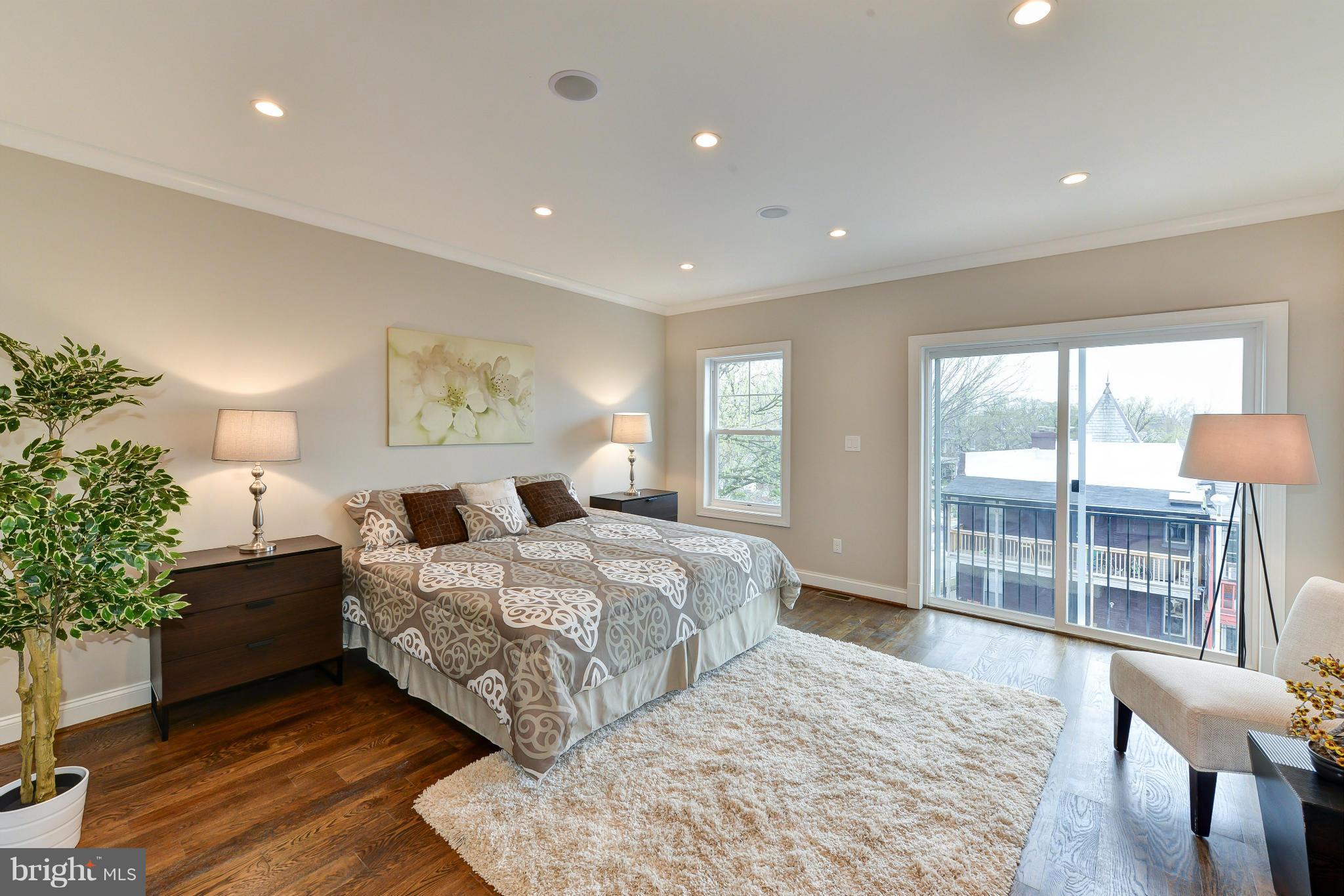 39 U Street Northeast, Unit 1 Washington, DC 20002 - Photo 19 of 27 a bedroom with a large bed and a large window