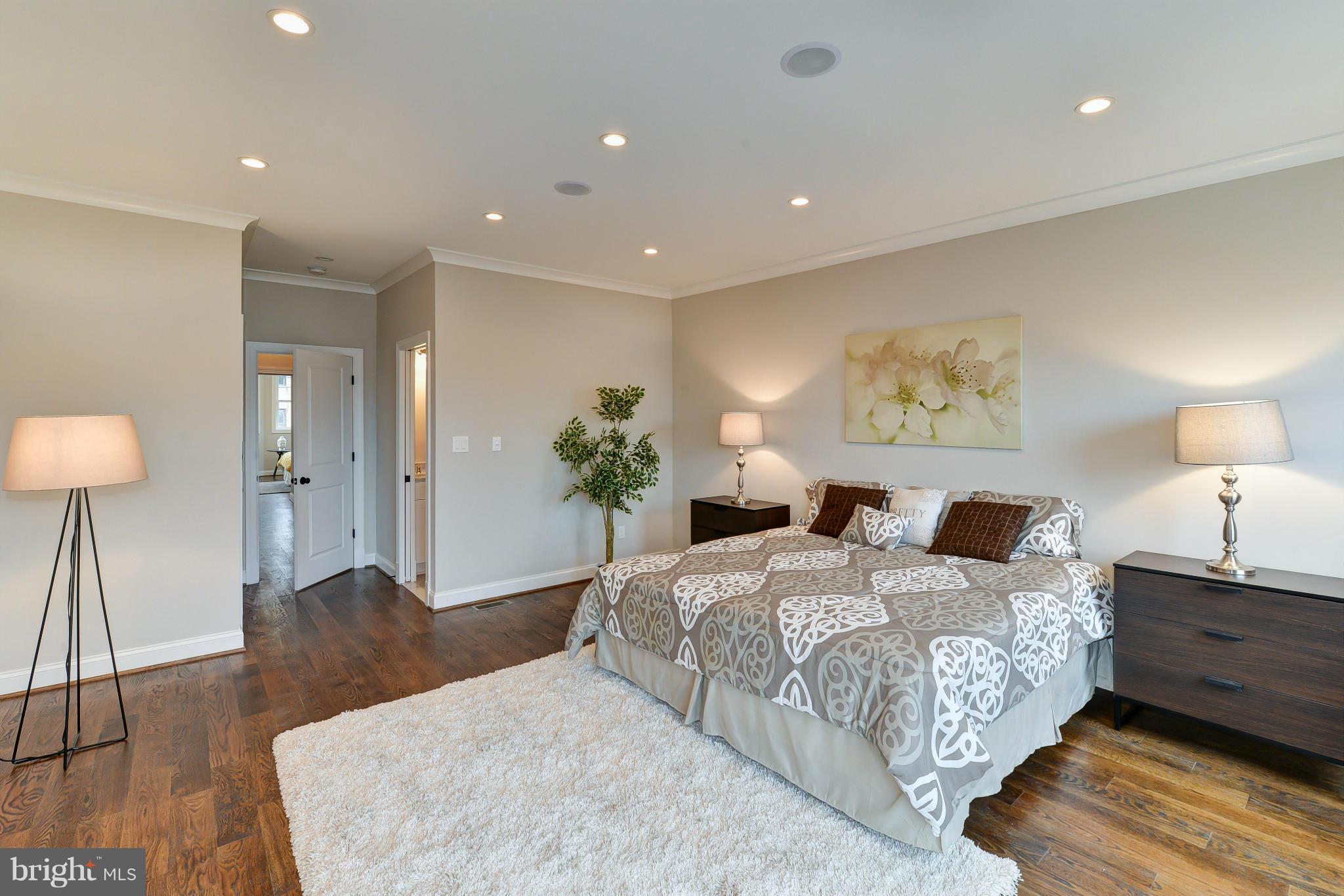 39 U Street Northeast, Unit 1 Washington, DC 20002 - Photo 20 of 27 a bedroom with a bed and a painting on the wall