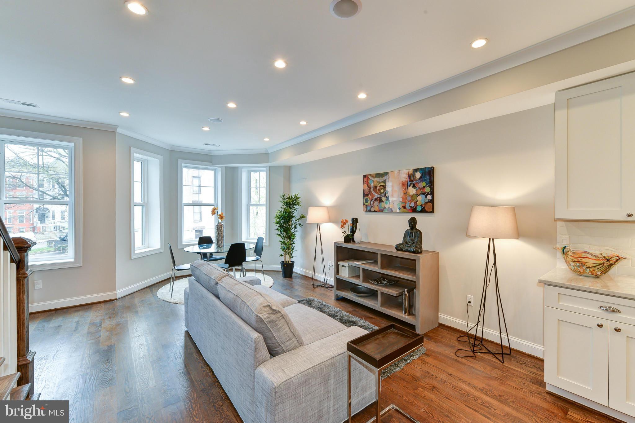 39 U Street Northeast, Unit 1 Washington, DC 20002 - Photo 3 of 27 a living room with furniture window and wooden floor